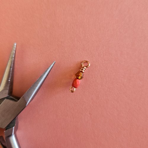 Margot Potter's Falloween Bracelet  - , Contemporary Wire Jewelry, Dapping, Dapping Jewelry, Findings, Clasps, Components, Wire Wrapping, Wrapping, Wire Wrapping Jewelry, Use chain-nose pliers to tuck the wire tail above the top bead.    